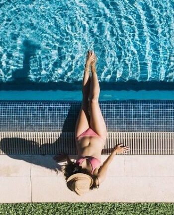 top-view-girl-relaxing-pool
