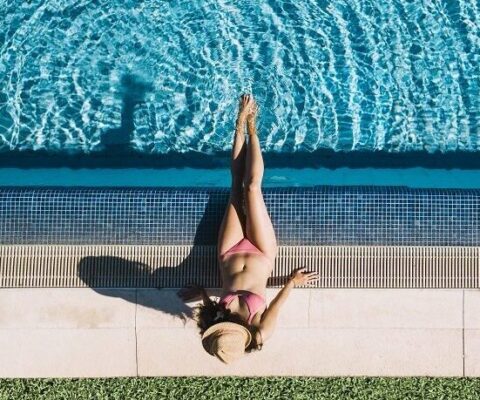 Top-view-girl-relaxing-pool